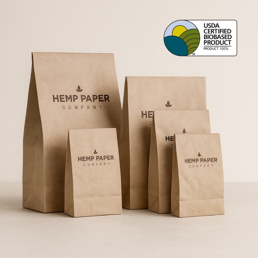 Hemp paper bags with USDA BioPreferred certification label showing 100% biobased content
